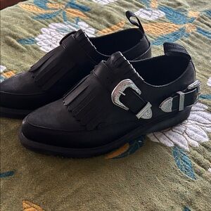 Dr. Martens Black Fringe Buckle Loafers
